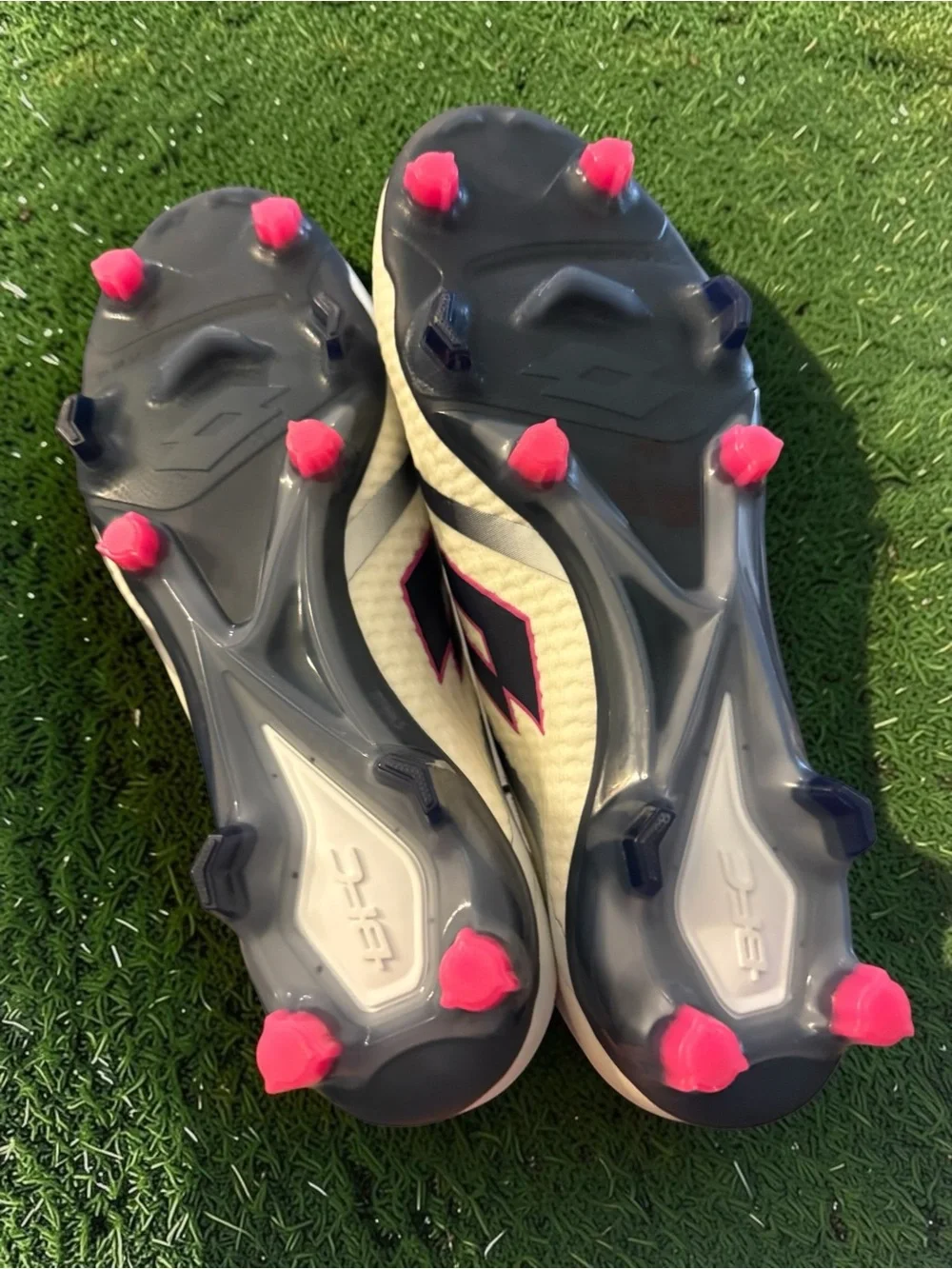 Lotto Maestro 100 IV FG soccer cleats in white with blue and pink details. -nwt
